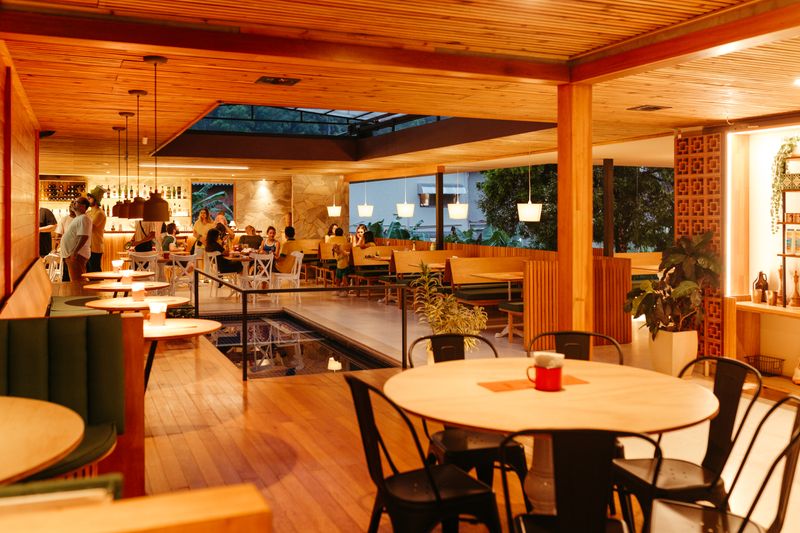 Red Rooster restaurant interior with warm lighting and inviting dining atmosphere